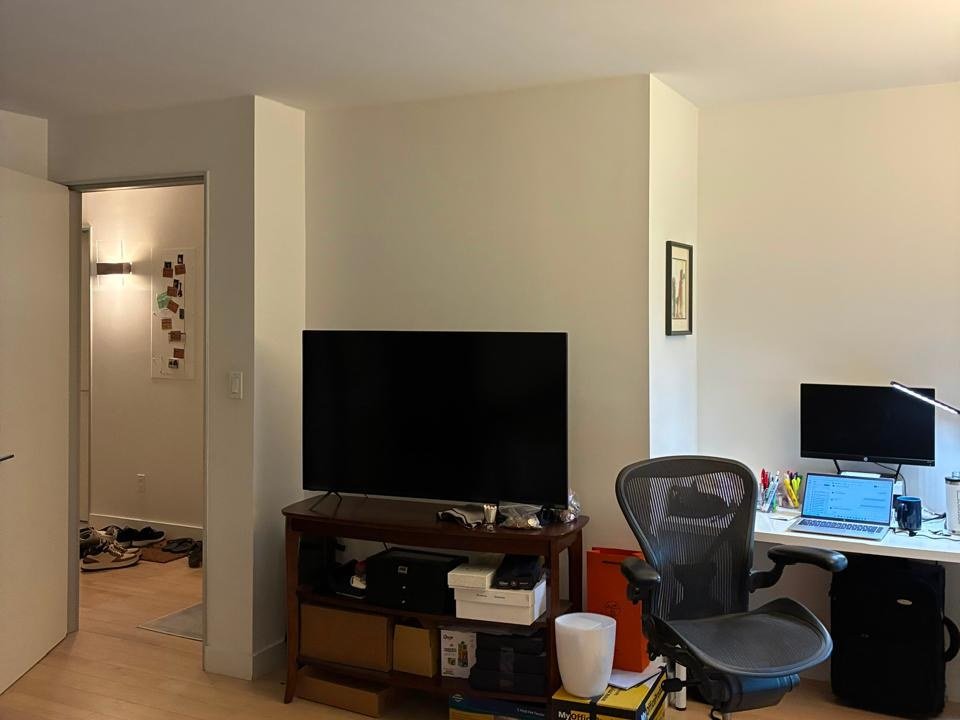 Living area with freshly painted white walls in a New York apartment