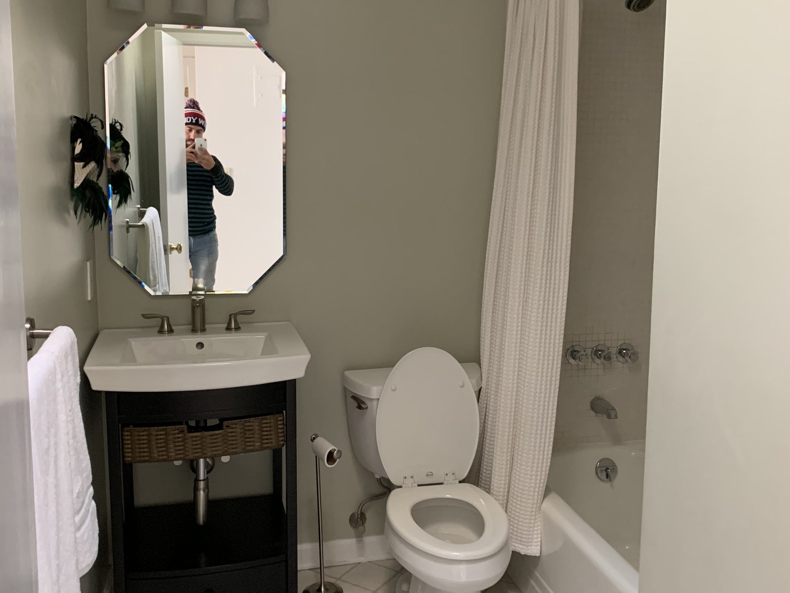 How long does interior paint last in a bathroom: sage-gray walls with white crown molding